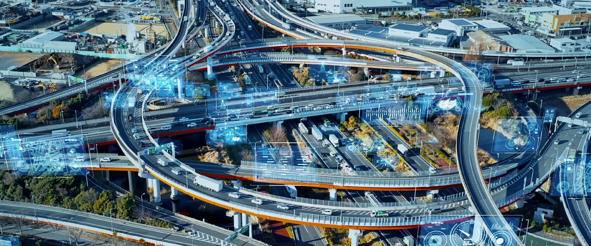Vehicles traverse a network of highways to show how logistics tech is changing how delivery and transport vehicles move. There is a digitally imposed overlay of graphs and figures.